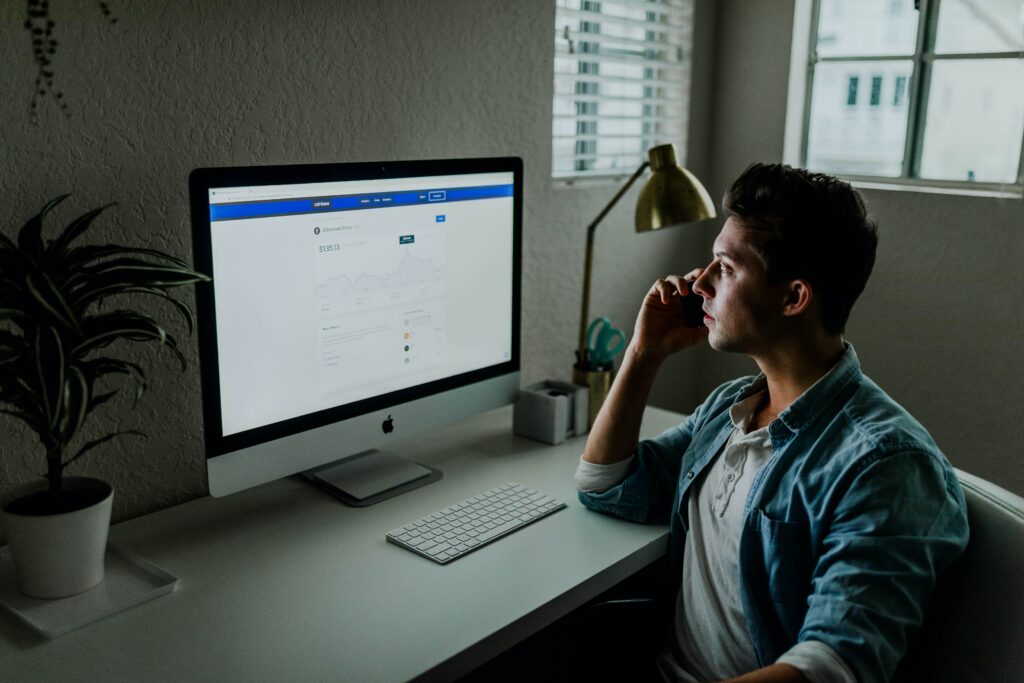 A data analyst reviewing a detailed spreadsheet on a computer, emphasizing the need for fresh, accurate, and complete data for successful ABM.